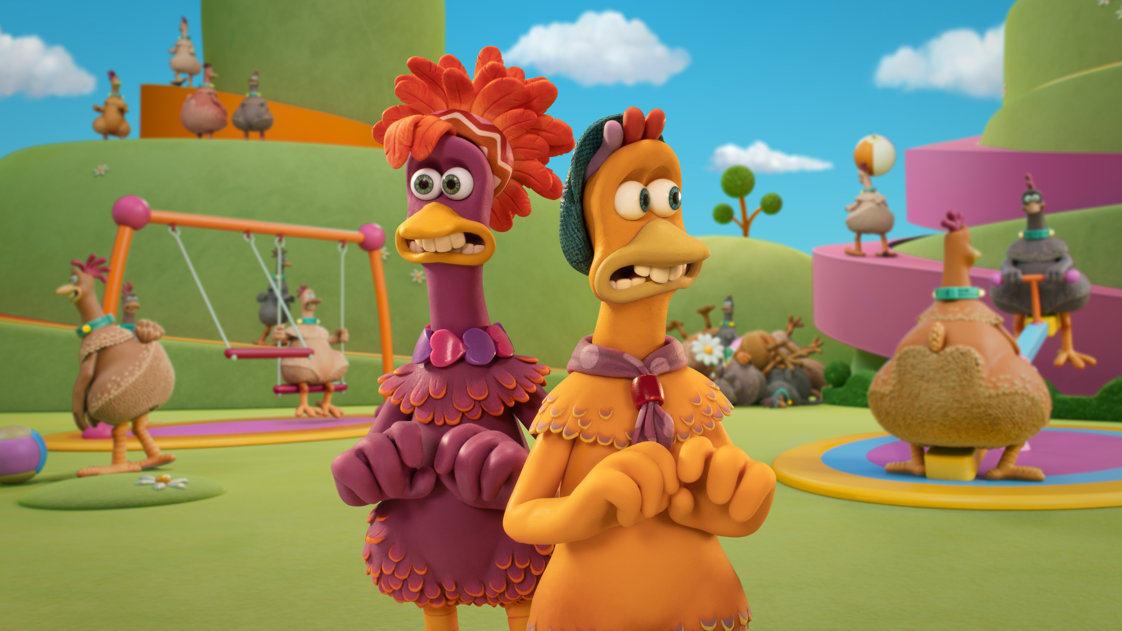 Molly and Frizzle, two claymation chickens, standing with their backs to each other and looking scared in Chicken Run: Dawn of the Nugget