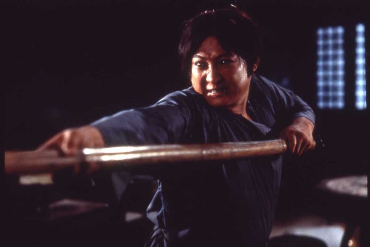 Sammo Hung uses a pole to fight in Encounters of the Spooky Kind