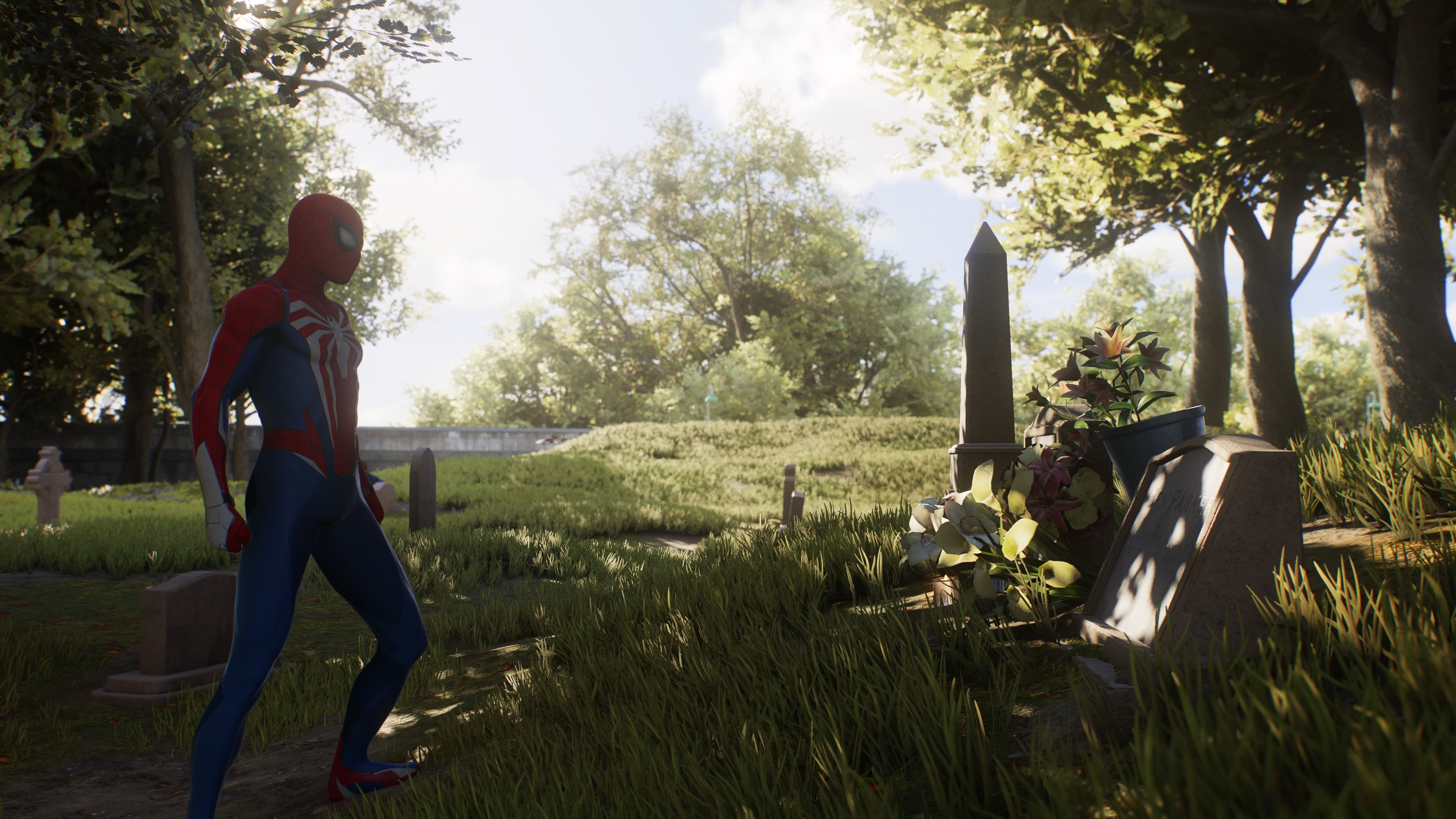 Peter Parker stands in front of a tombstone in Marvel’s Spider-Man 2