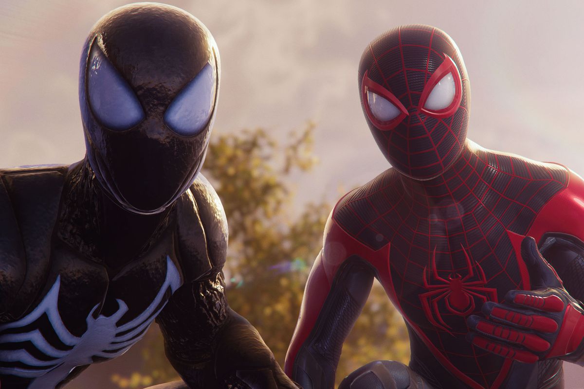 Peter Parker in the black suit and Miles Morales look at the camera together in Marvel’s Spider-Man 2